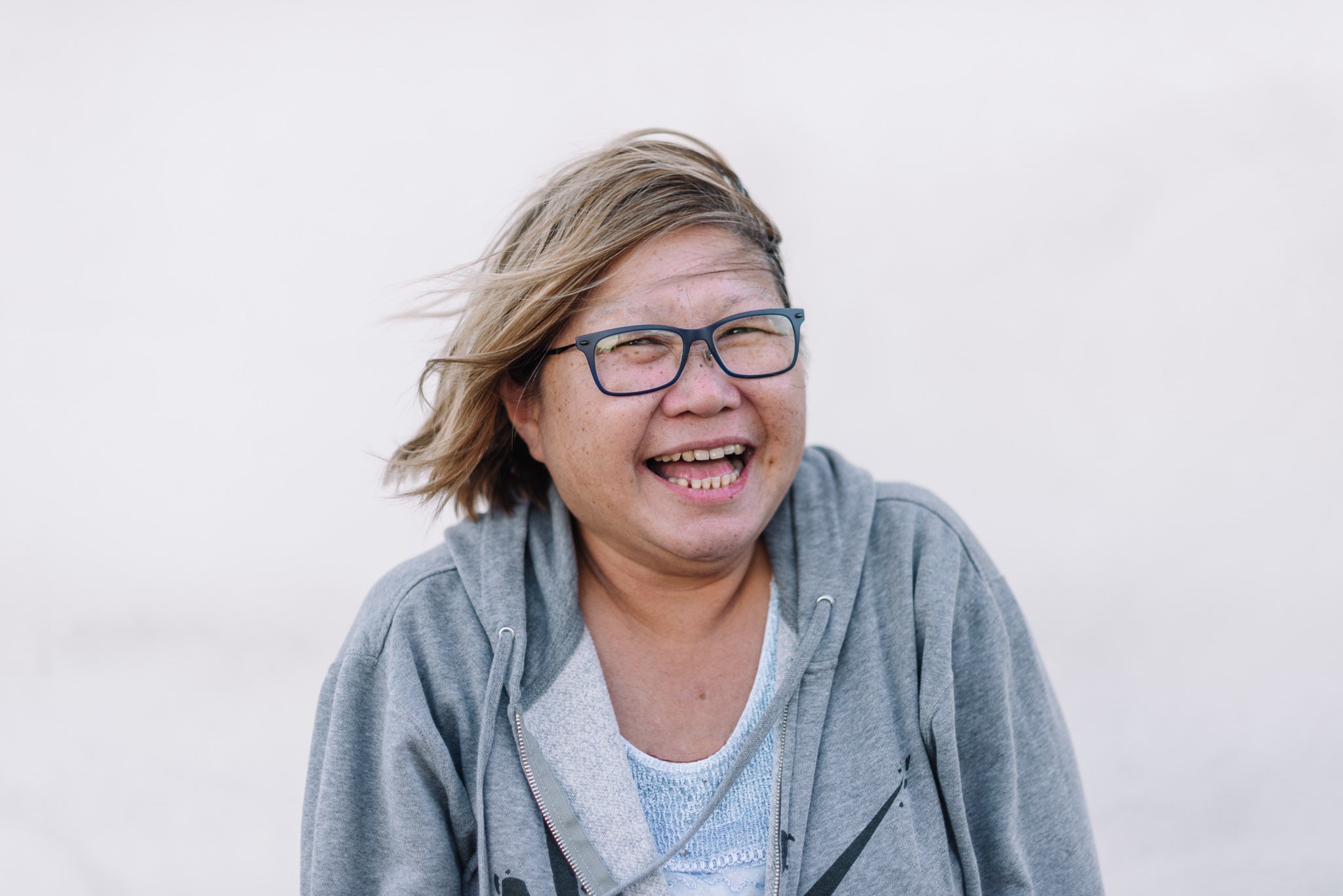 files/a-beaming-windswept-woman-of-asian-background.jpg